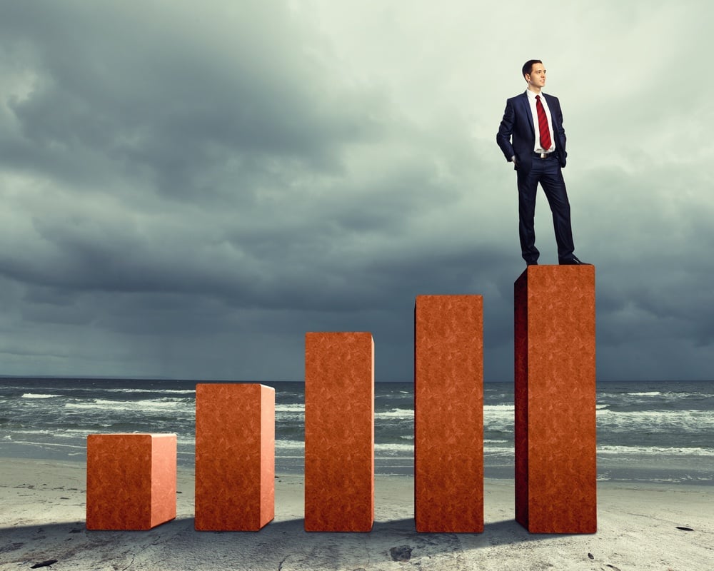 Business person on a graph, representing success and growth.jpeg
